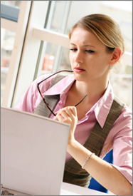 Photo of woman at computer.